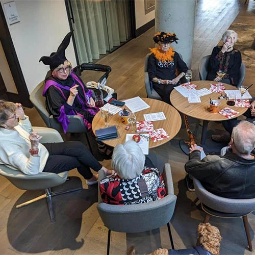 Residents from the Edward enjoying company with one another during Halloween celebrations.